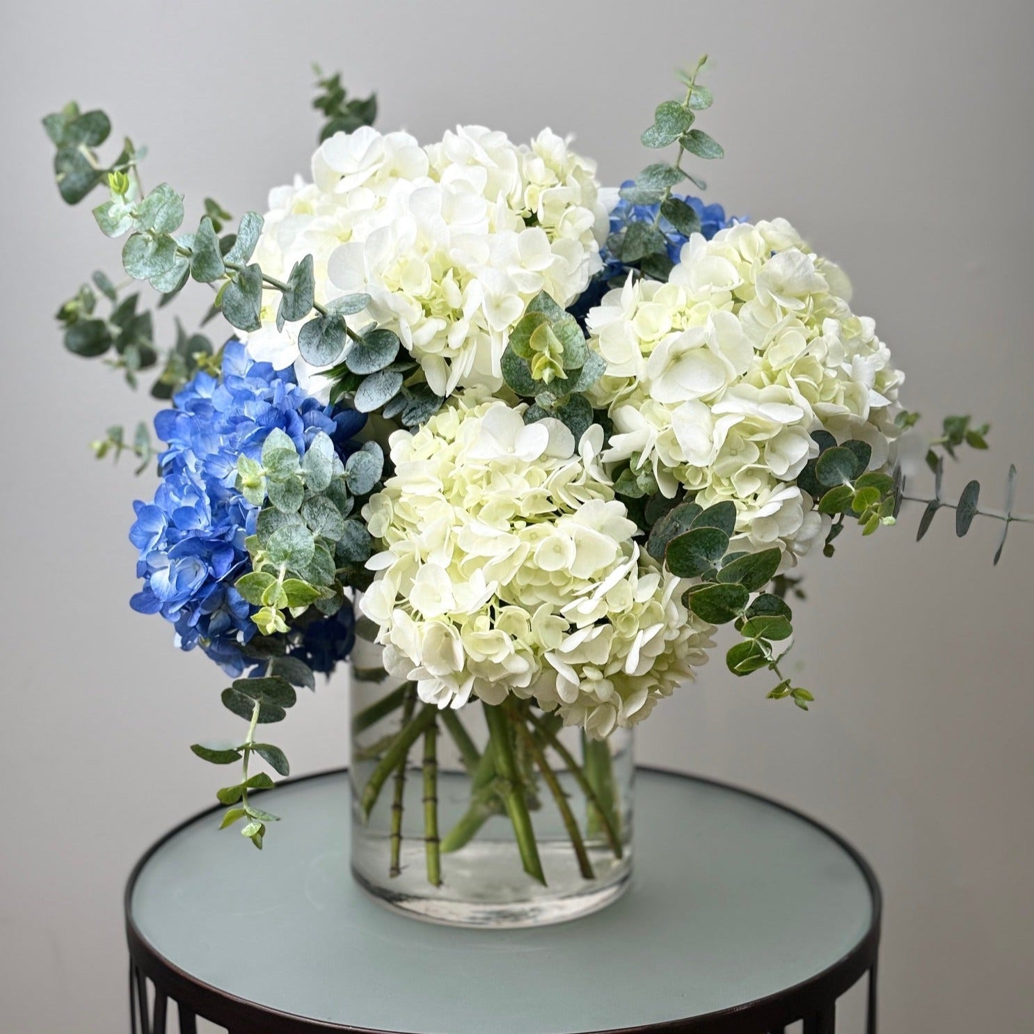 Blue and White Hydrangea Arrangement by Jolie Flower Shop of Cape Cod