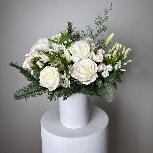 Bouquet of white and green flowers on a gray background
