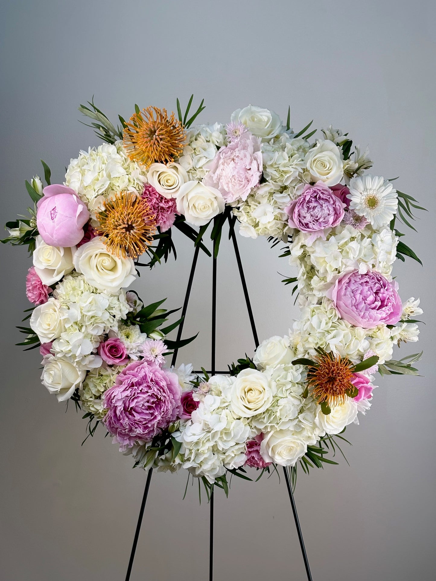 Pastel Funeral Flower Wreath by Jolie Flower Shop of Cape Cod