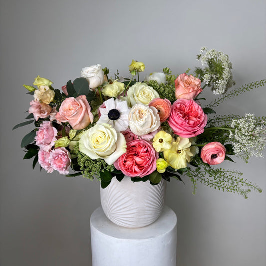 luxury vase with premium blooms on gray background